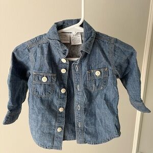 Button down, looks cute on its own or open with another shirt underneath.